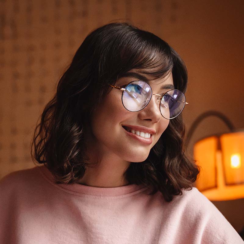 brunette young woman indoors in cafe writing notes 8MGMPPL