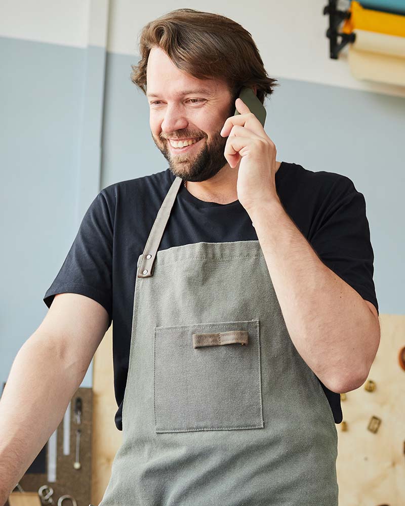 smiling man managing small business 8JQBRA2